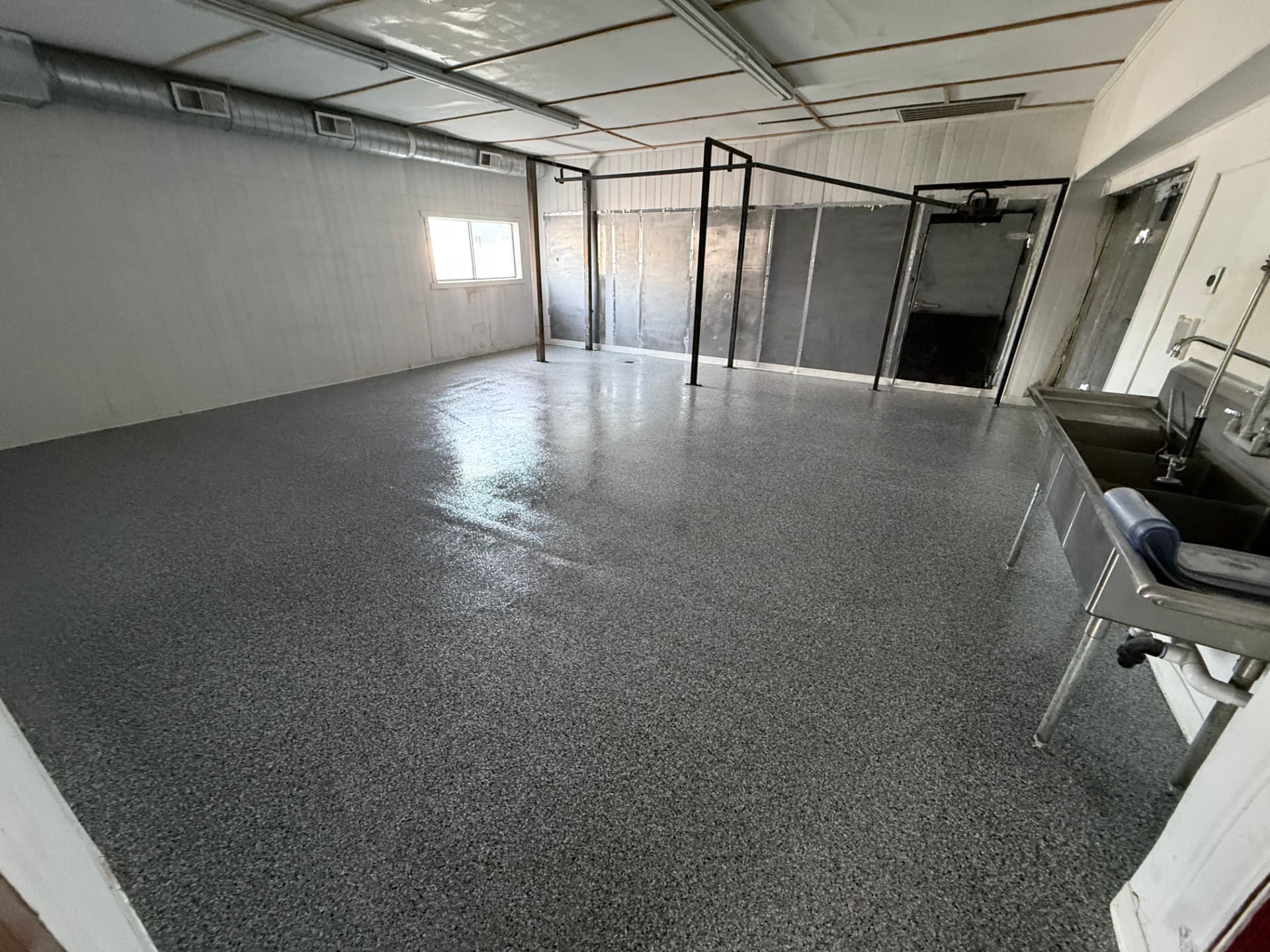 Commercial space with gray flake floor