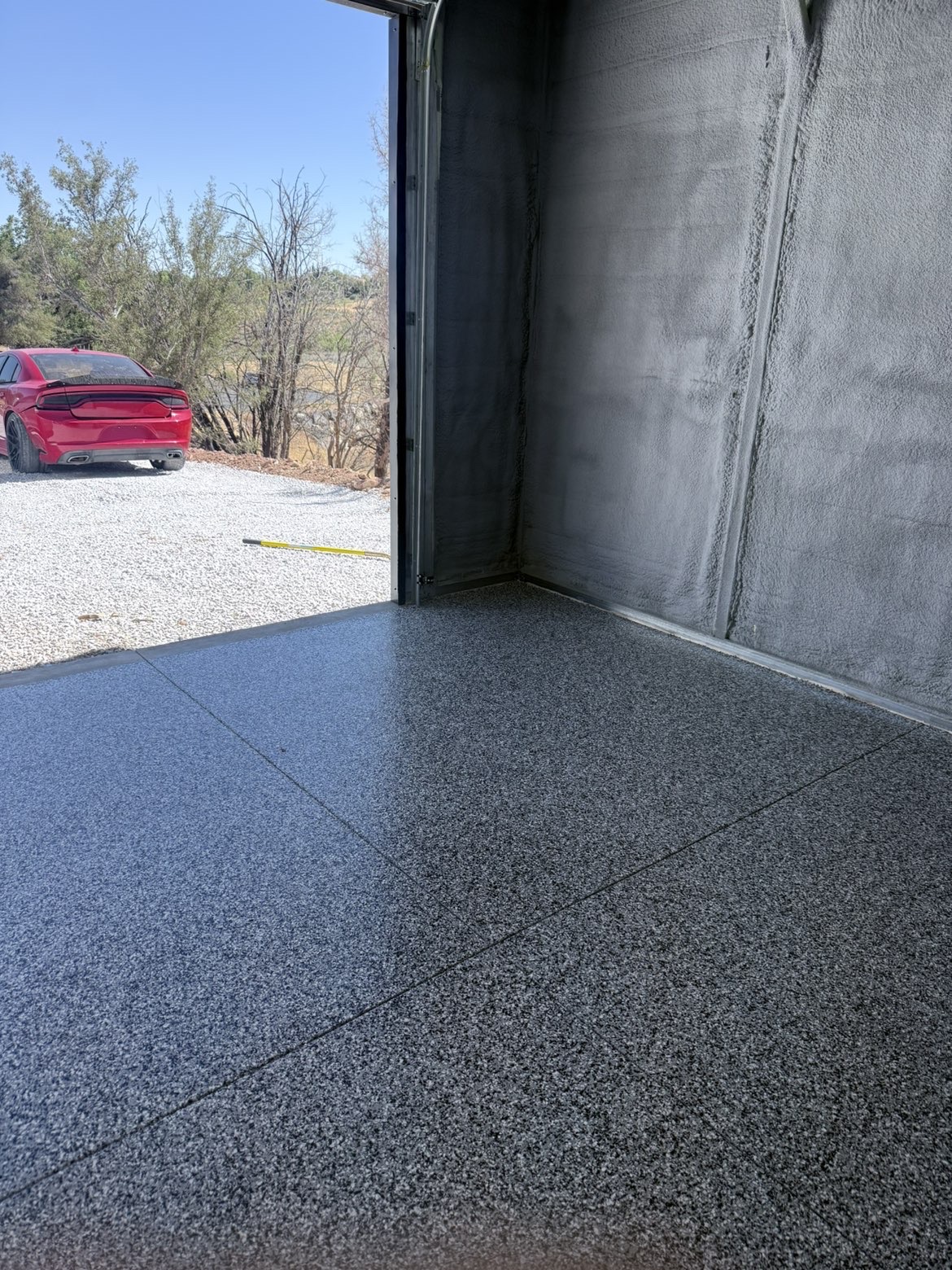 Gray flake garage floor with open garage door