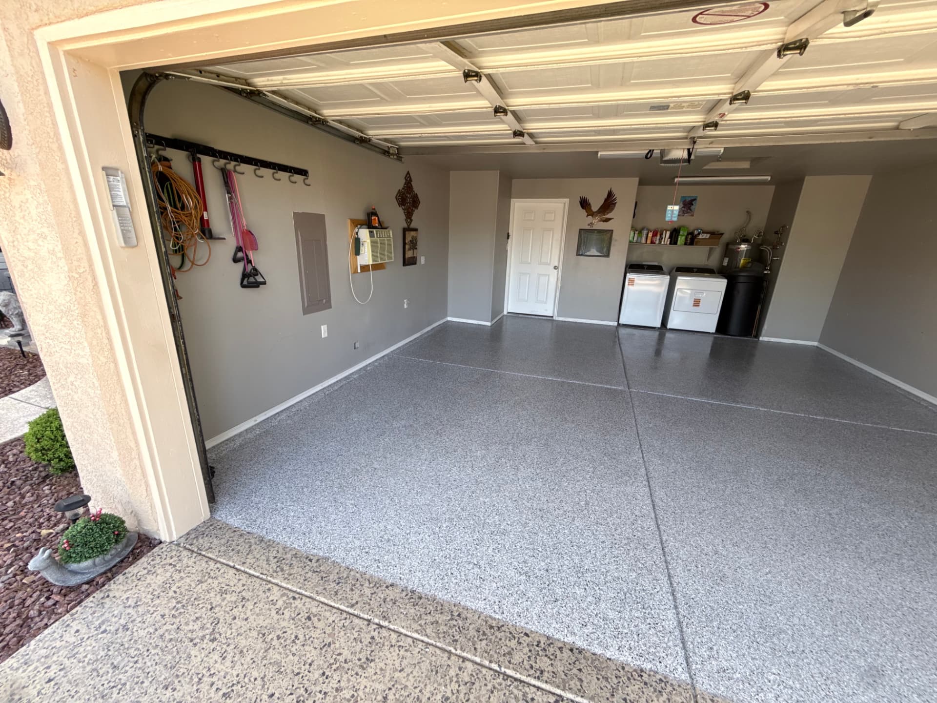 Gray flake garage floor with washer and dryer area