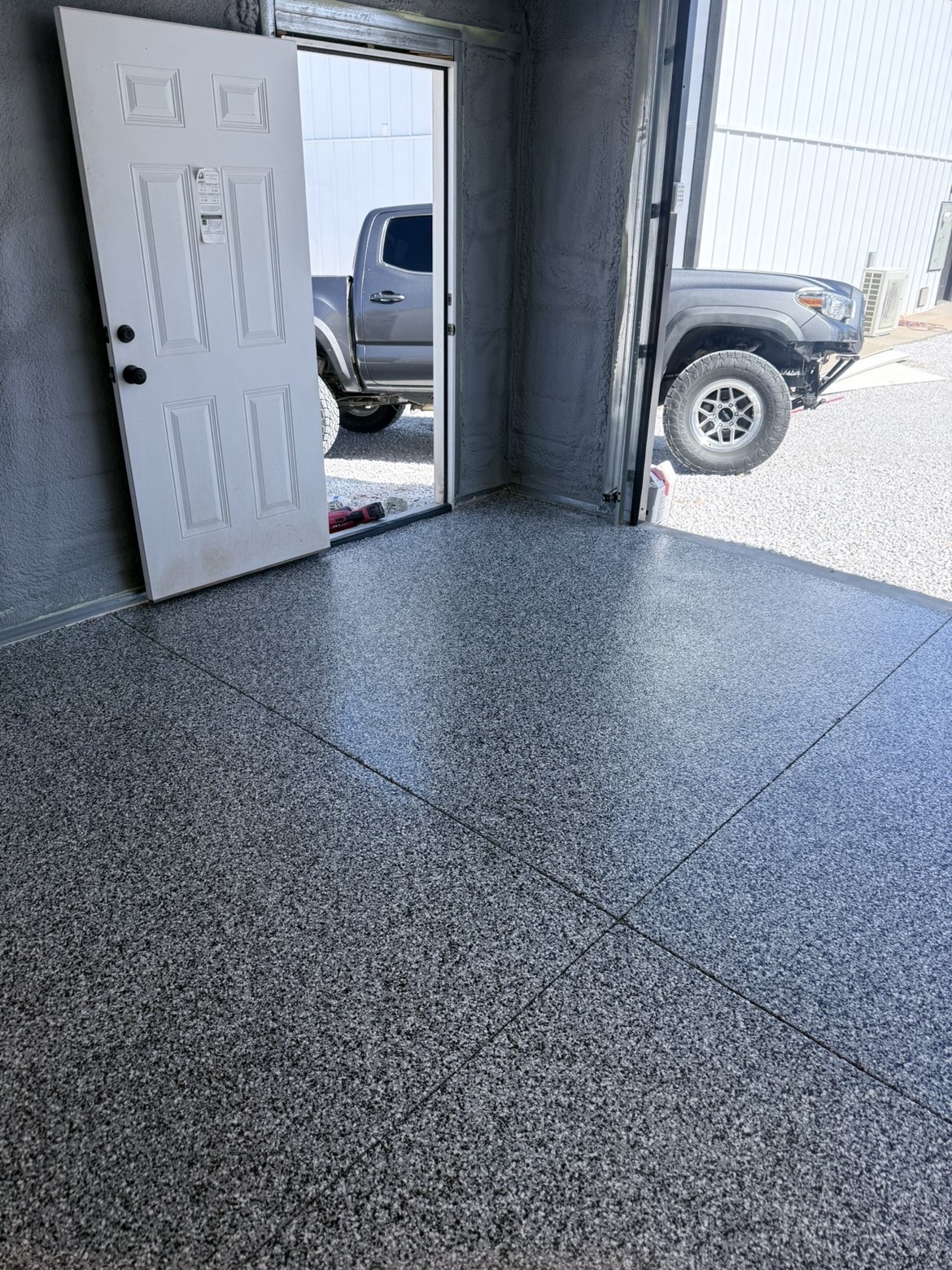 Flake coated shop floor with entry door