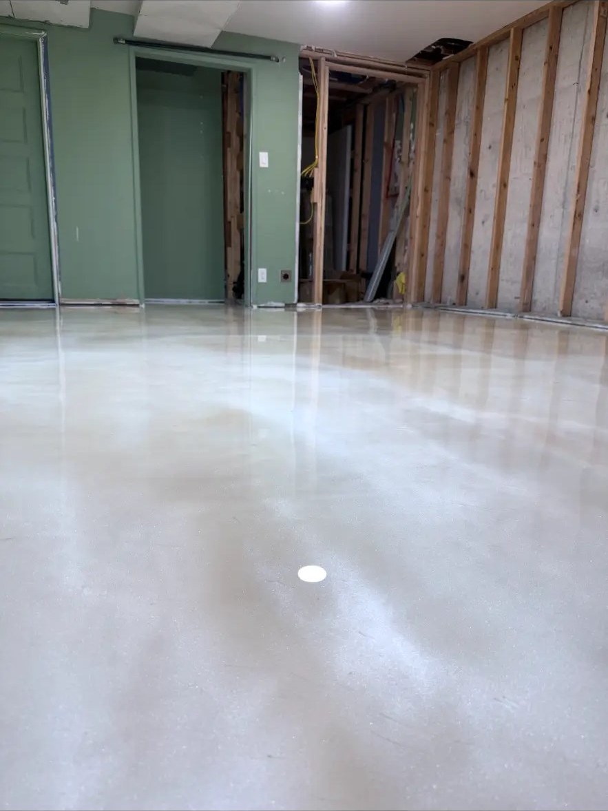 Glossy sealed concrete floor in a shop remodel
