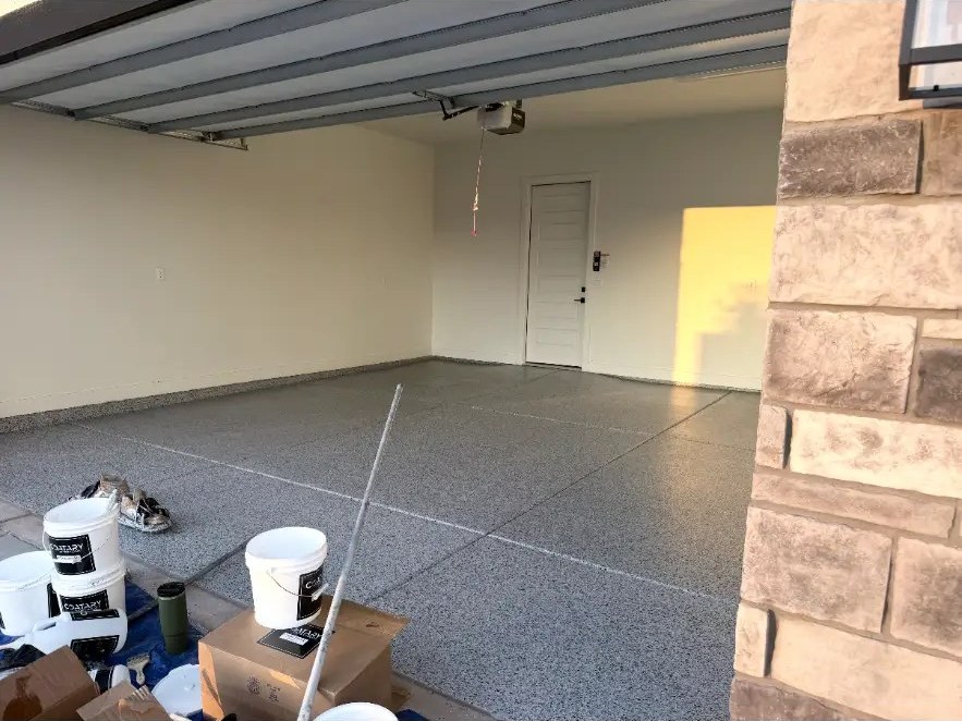 Garage entry with new flake floor during cleanup