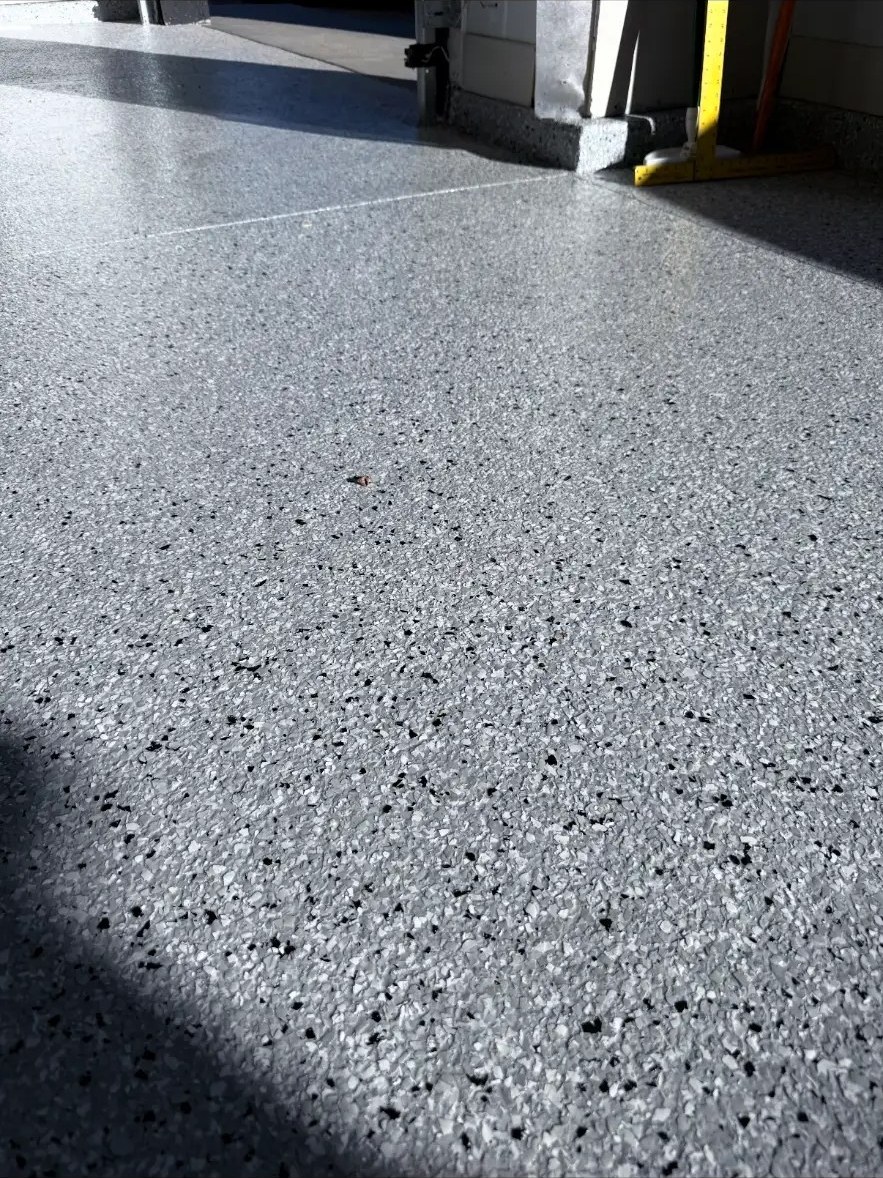Sunlight across a freshly coated flake garage floor