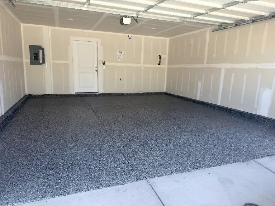 Finished gray flake garage floor with open garage door